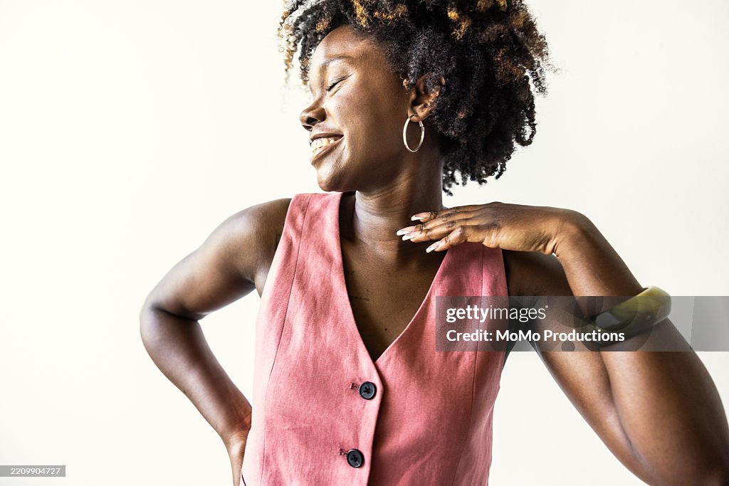 Portrait of beautiful and fashionable young woman on white background