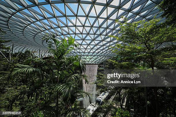 General view of the Rain Vortex, the world’s tallest indoor waterfall, as a skytrain passing through Jewel Changi Airport on April 11 in Singapore....
