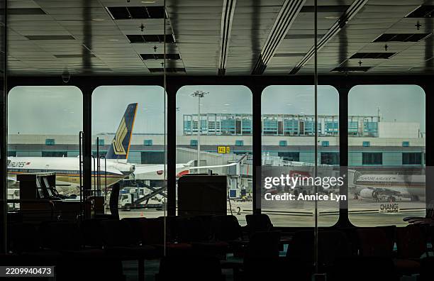 Singapore Airlines aircrafts are seen taxiing on the tarmac at Singapore Changi Airport on April 11, 2025 in Singapore. Singapore, one of the world's...