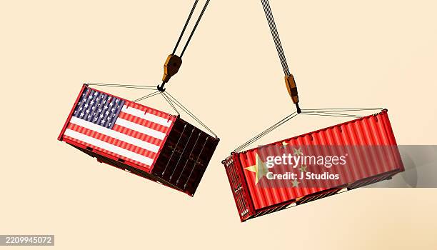 trade clash: american and chinese flag shipping containers on collision course - trade war stock pictures, royalty-free photos & images