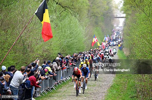 Ben Swift of Great Britain and Team INEOS Grenadiers and Sven Erik Bystrom of Norway and Team Groupama - FDJ and a general view of the peloton...