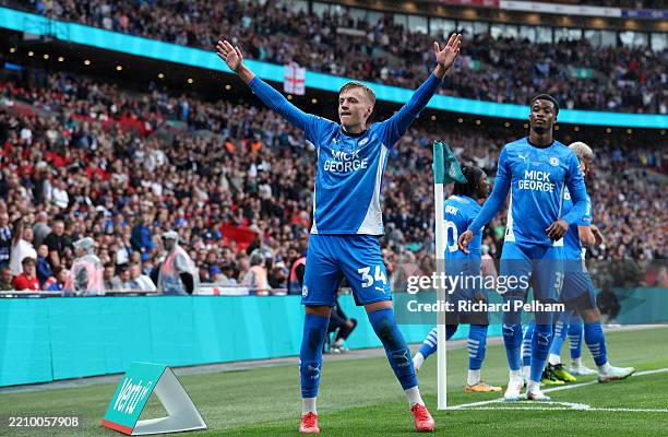 Harley Mills of Peterborough United celebrates scoring his team's first goal during the Vertu EFL Trophy Final match between Birmingham City and...