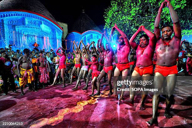 Hindu devotees seen standing in a queue during the prayer time of Gajan Festival. Gajan is a Hindu festival celebrated mostly in the rural part. The...