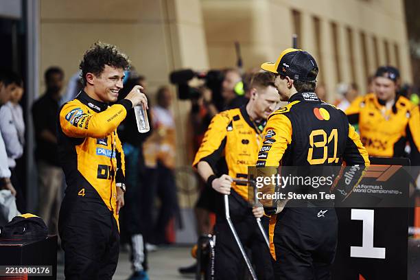 Third placed Lando Norris of Great Britain and McLaren and Race winner Oscar Piastri of Australia and McLaren talk in parc ferme during the F1 Grand...