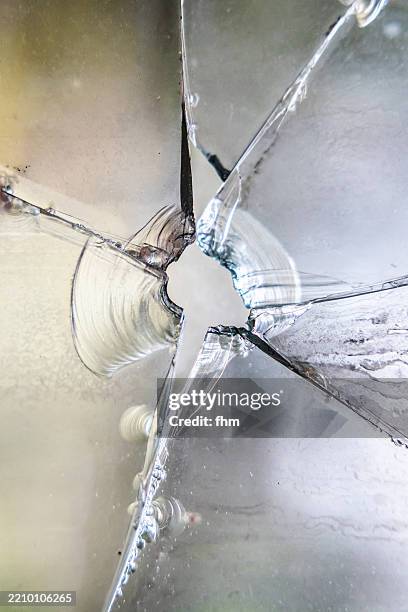 shattered glass after a pistol shot - broken drinking glass stock pictures, royalty-free photos & images