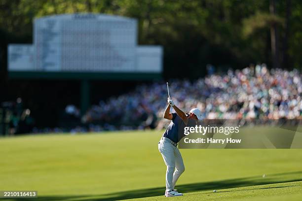 Rory McIlroy of Northern Ireland plays his second shot on the 13th hole during the final round of the 2025 Masters Tournament at Augusta National...
