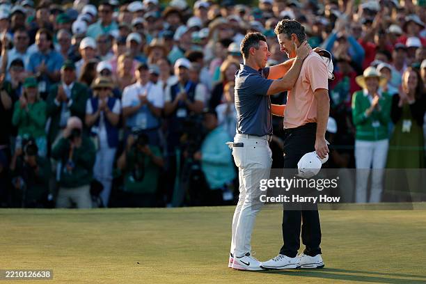 Rory McIlroy of Northern Ireland shakes hands with Justin Rose of England after the first playoff hole during the final round of the 2025 Masters...