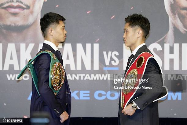 Bantamweight champion Junto Nakatani and his IBF counterpart Ryosuke Nishida pose for a photo in Tokyo on April 18 following a press conference for...