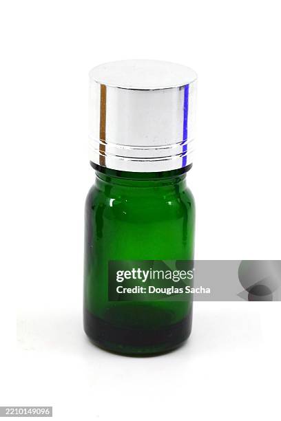 essential oil bottle on white background - tea tree oil stock pictures, royalty-free photos & images