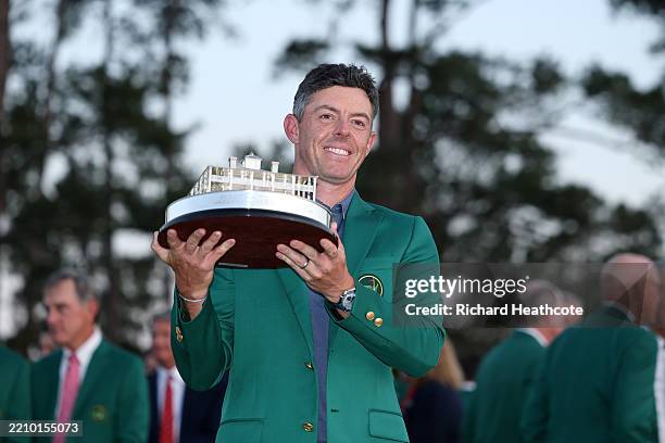 Rory McIlroy of Northern Ireland poses with the Masters trophy during the Green Jacket Ceremony after winning the 2025 Masters Tournament at Augusta...