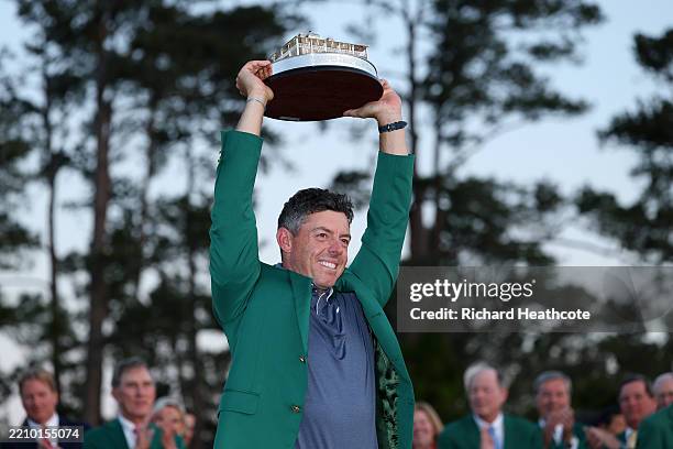 Rory McIlroy of Northern Ireland poses with the Masters trophy during the Green Jacket Ceremony after winning the 2025 Masters Tournament at Augusta...