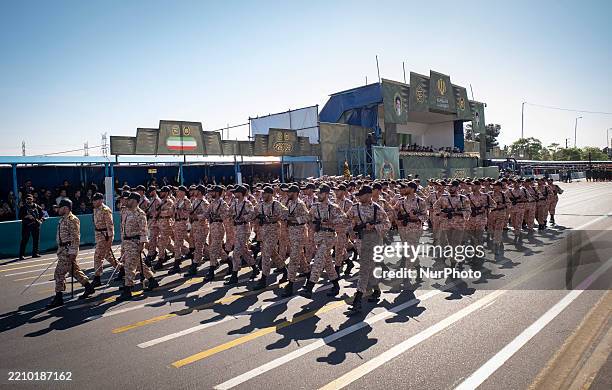 Iranian armed military forces march in a military parade commemorating the anniversary of Army Day outside the Khomeini Shrine in the south of...