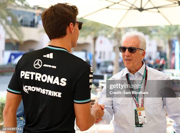 George Russell of Great Britain and Mercedes AMG Petronas F1 Team meets Piero Ferrari in the Paddock prior to the F1 Grand Prix of Bahrain at Bahrain...