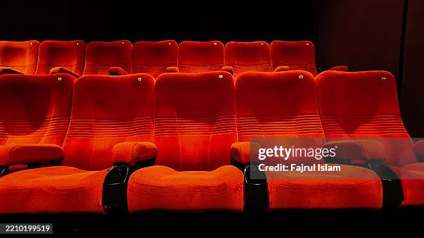 empty seats at movie theater - projection equipment stock pictures, royalty-free photos & images