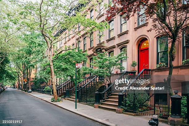 elegant brownstone apartment buildings in west village in summer, new york city, usa - west village stock pictures, royalty-free photos & images