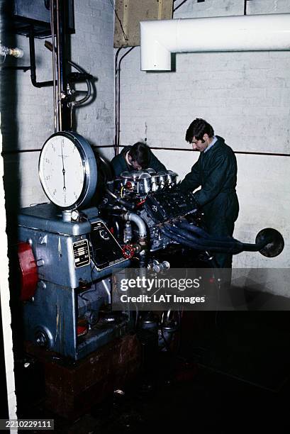 Technicians mount completed DVF to a dynamometer for power testing at the Cosworth factory, United Kingdom, 1969.