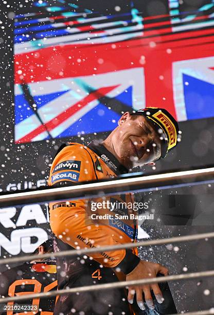 Third placed Lando Norris of Great Britain and McLaren celebrates on the podium during the F1 Grand Prix of Bahrain at Bahrain International Circuit...