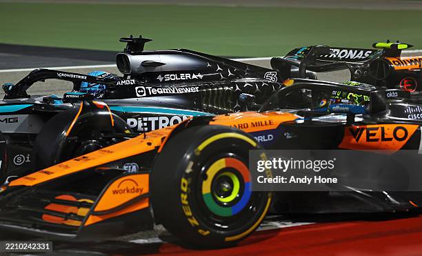 George Russell of Great Britain driving the Mercedes AMG Petronas F1 Team W16 and Lando Norris of Great Britain driving the McLaren MCL39 Mercedes...