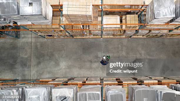 warehouse supervisor and employee checking inventory through a medical storage facility - industrial style stock pictures, royalty-free photos & images