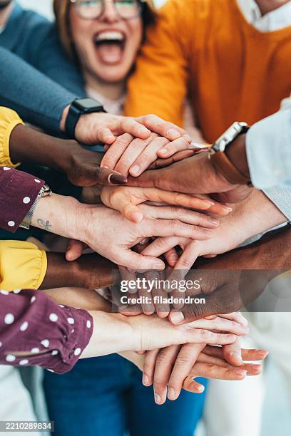 teamwork - stacked hands stock pictures, royalty-free photos & images