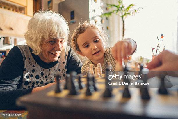 caring for family. multigenerational family share time together - life span stock pictures, royalty-free photos & images