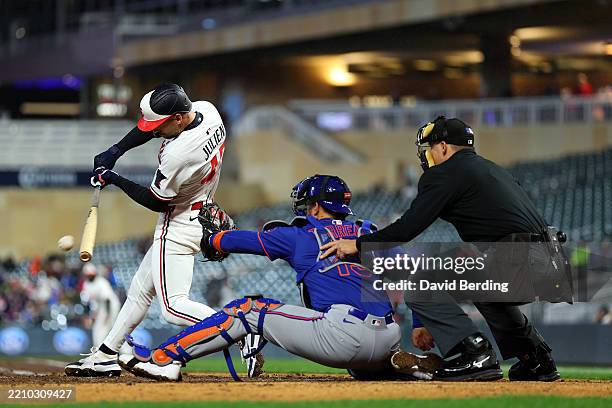 Edouard Julien of the Minnesota Twins hits a single against the New York Mets in the fifth inning at Target Field on April 14, 2025 in Minneapolis,...