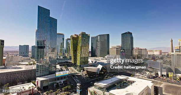 tall skyscrapers on the vegas strip on a clear day - aerial shot - casino stockfoto's en -beelden