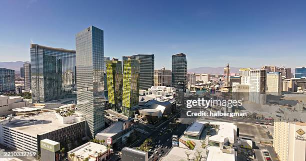 tall skyscrapers on the vegas strip on a clear day - drone shot - las vegas skyline daytime stock pictures, royalty-free photos & images