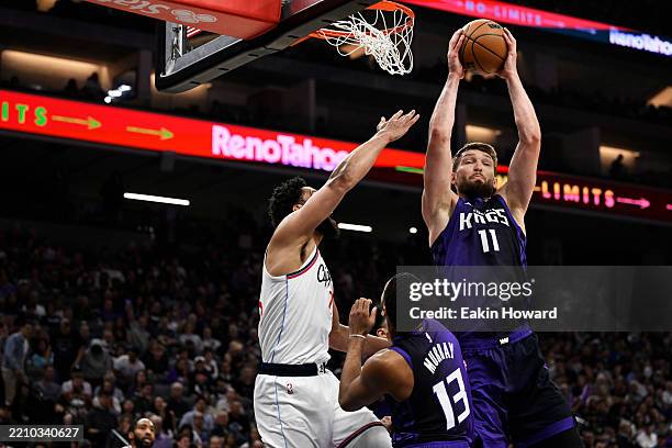 Domantas Sabonis of the Sacramento Kings catches a rebound against the Los Angeles Clippers in the second quarter at Golden 1 Center on April 11,...