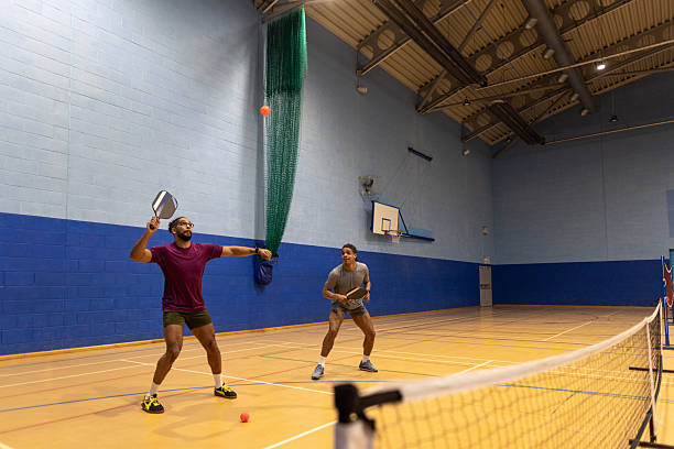 Two people playing pickleball