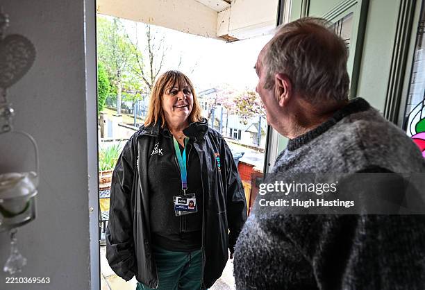 Community Health and Wellbeing Worker Trudie Dove visits Bodmin residents David and Pamela Johnston in their home, on April 15, 2025 in Bodmin,...