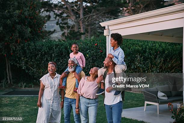 black family, carry on shoulder and children in backyard for nature view, fun or bonding. kids, parents and grandparents together at home for happiness, care or funny laugh in garden outdoor - familie met twee generaties stockfoto's en -beelden