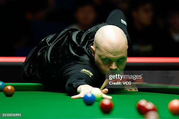Elliot Slessor of England plays a shot in the fourth round match against Zhao Xintong of China on day 9 of World Championship Qualifiers 2025 at...