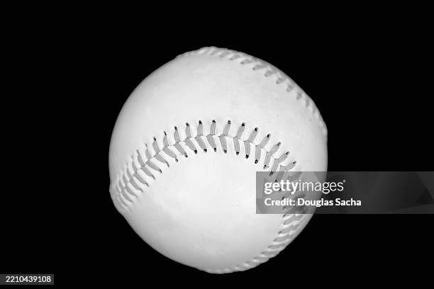baseball on a reflective black background - scoring run stock pictures, royalty-free photos & images