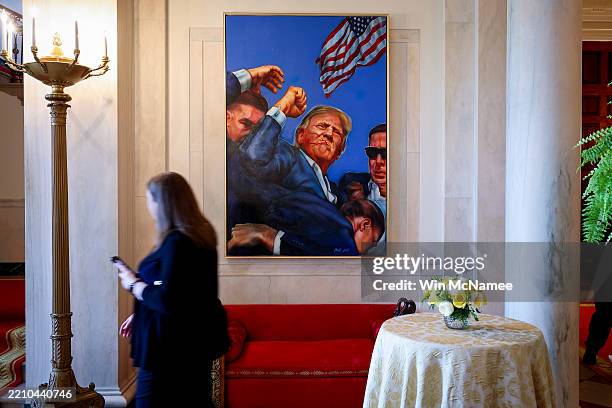 Painting depicting the Associated Press photograph of the aftermath of the assassination attempt on then U.S. Presidential candidate Donald Trump in...