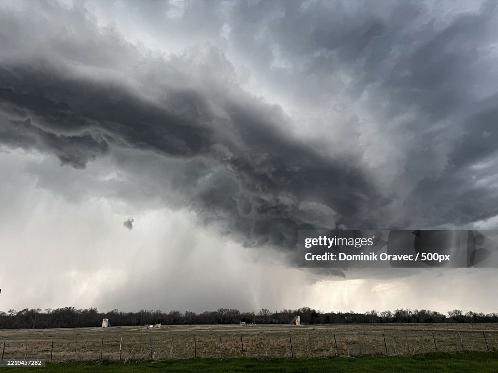 Scenic view of field against storm clouds,Limestone County,Texas,United States,USA