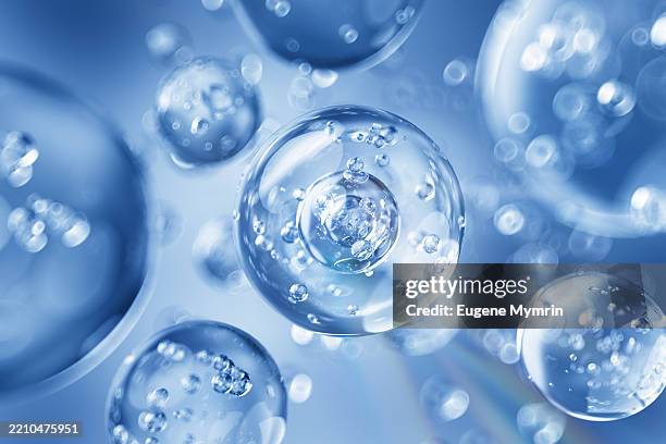 innovative molecules floating above water surface representing scientific cosmetic research - cells under microscope stock pictures, royalty-free photos & images