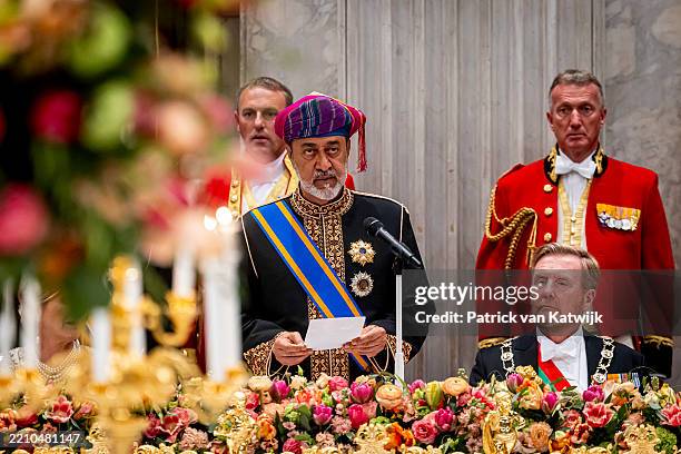 Sultan Haitham bin Tarik, with King Willem-Alexander of The Netherlands, speaks during a state banquet at the Royal Palace at the start of the...