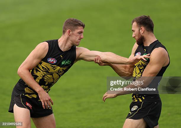 Ben Miller of the Tigers and Noah Balta of the Tigers are seen during a Richmond Tigers AFL training session at Punt Road Oval on April 16, 2025 in...
