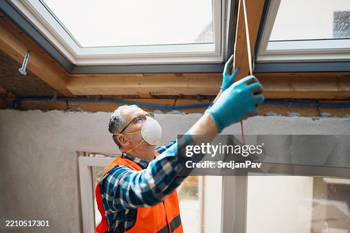 Attic Window Ruler Worker Measuring Dimensions For Attic Window Installation In Renovation ...