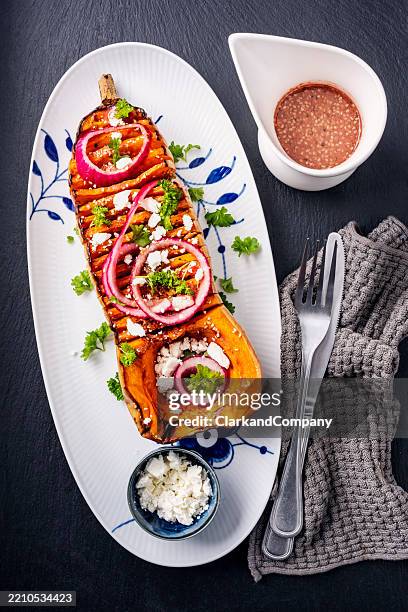 butternut squash with kimchee and feta cheese - tahini stock pictures, royalty-free photos & images