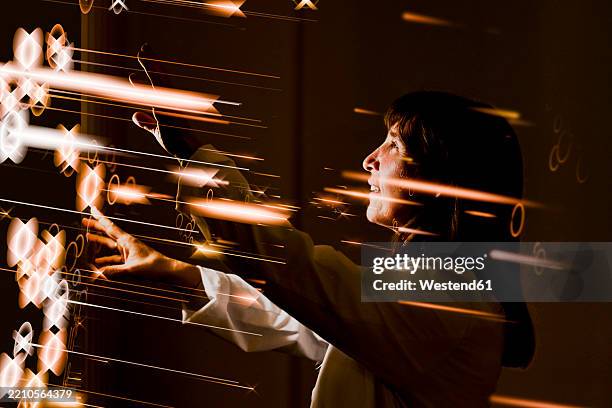 doctor interacting with 3d visualization in a medical setting - dynamic portrait stock illustrations
