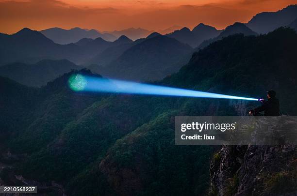 outdoor adventure lighting - head torch stock pictures, royalty-free photos & images