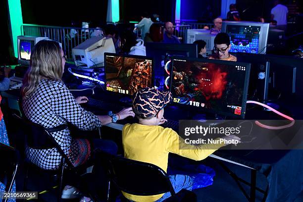 Ei Rive Children play video games during the Rive 2 Geek festival in Rive de ...