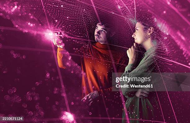 two people interacting with augmented reality technology in a futuristic setting - virtual collaboration stock pictures, royalty-free photos & images