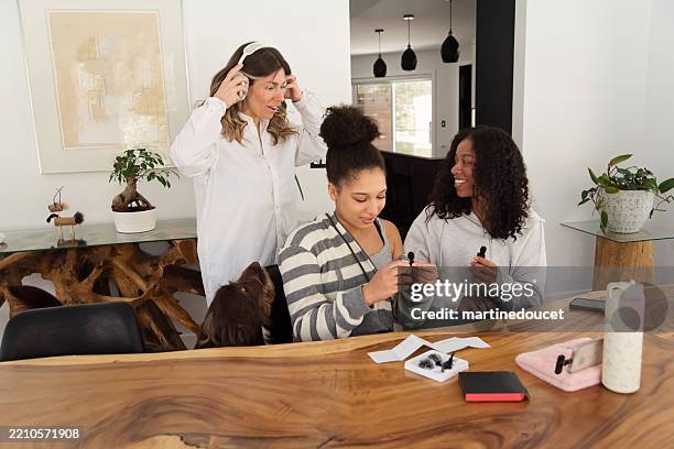multiracial sisters and mother prepping for a social-media session. - day in the life series stock pictures, royalty-free photos & images
