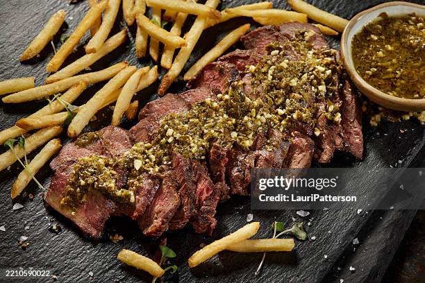 bison steak frites with chimichurri sauce - bison meat stock pictures, royalty-free photos & images