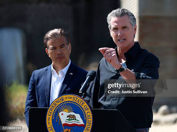 California Governor Gavin Newsom speaks as California Attorney general Rob Bonta looks on during a news conference at Gemperle Orchard on April 16,...