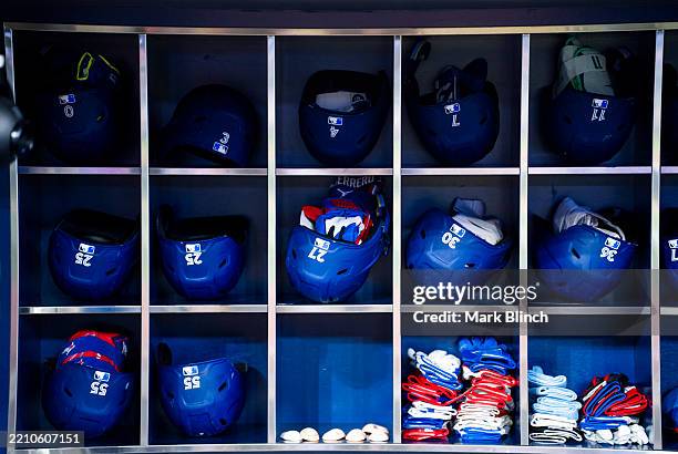 Toronto Blue Jays batting helmets and gloves are seen in the dugout ahead of the game against the Atlanta Braves in their MLB game at the Rogers...