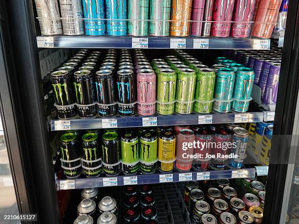 Cans of Monster Beverage Corporation energy drinks fill a store's shelves on April 16, 2025 in Miami, Florida. As the federal government looks to cut...